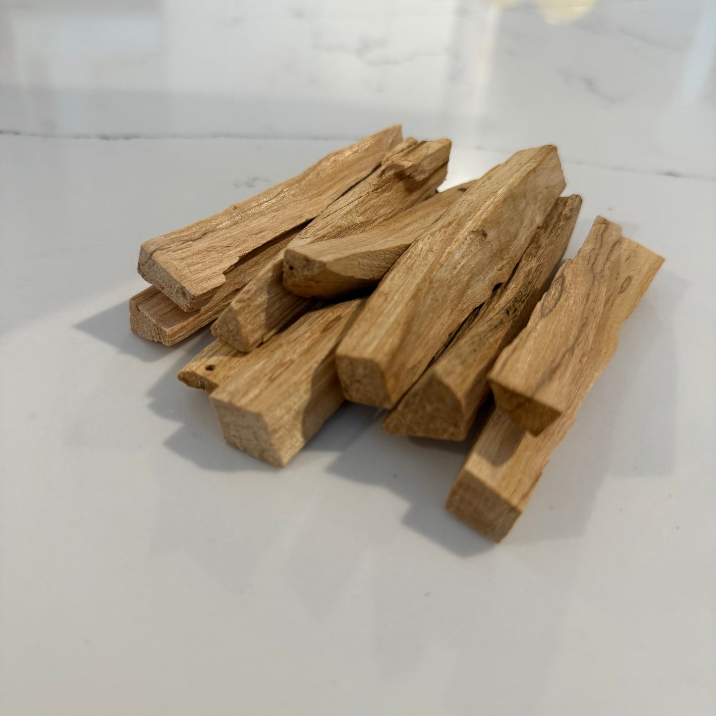 Stack of wooden logs on a white background