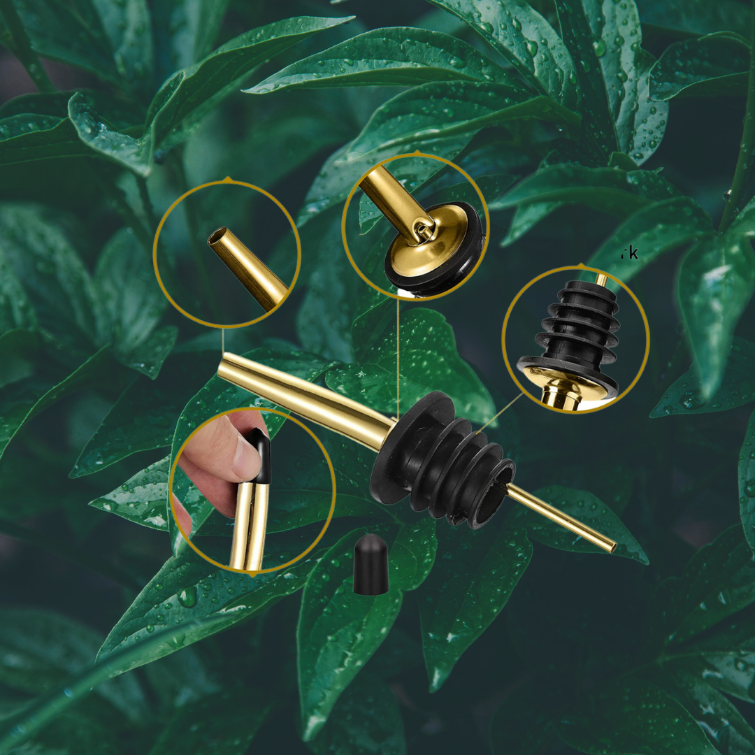 Gold Stainless Steel Bottle Pourer Over a green leafed backgrounds