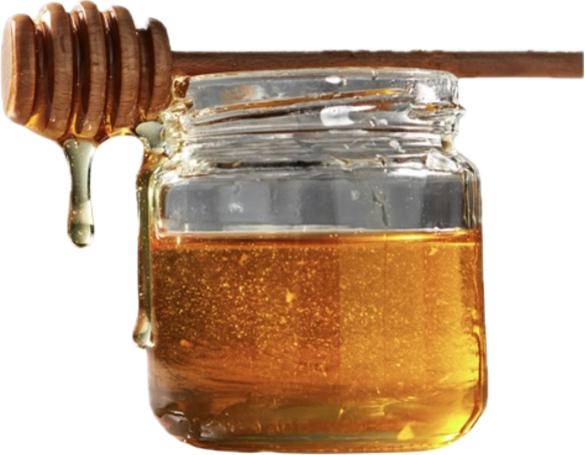 Jar of honey with a wooden dipper on a white background